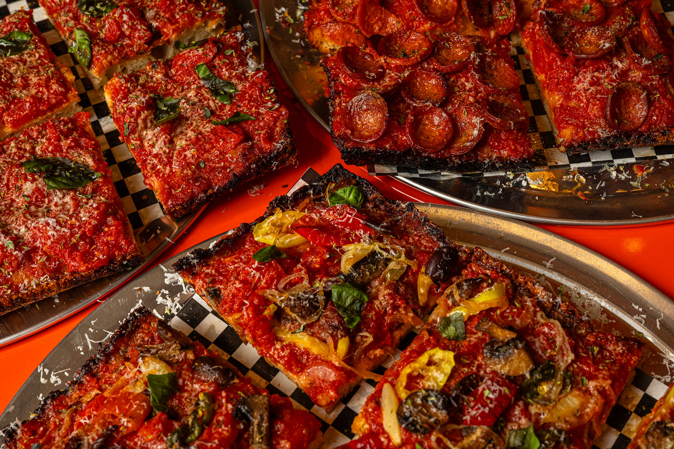 Sicilian pies on trays seen from above